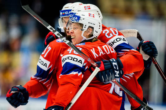 Ken Andre Olimb of Norway celebrates with teammates