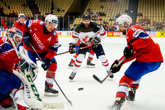 Mathis Olimb of Norway, Aaron Ekblad of Canada and Jonas