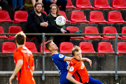 Hólmbert Fridjónsson of Aalesund and Nikolai Harris of Åsane during the OBOS-ligaen match between Åsane and Aalesund on May 13, 2018 in Åsane. 
