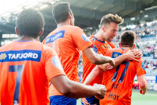 Kaj Ramsteijn and Sondre Fet of Aalesund celebrate the 0-2 goal with teammates