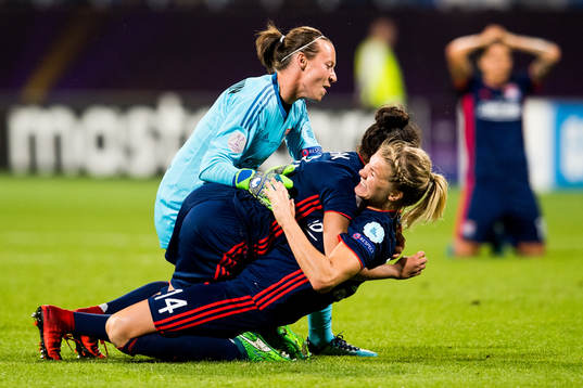 Ada Hegerberg of Lyon celebrates at the final whistle with teammates Pauline Peyraud-Magnin and Selma Bacha after winning the UEFA Women's Champions League final between VfL Wolfsburg and Olympique Lyonnais on May 24, 2018 in Kyiv.
