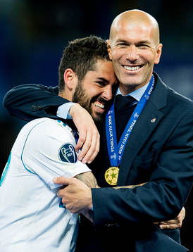 Isco and Zinedine Zidane, head coach of Real Madrid,