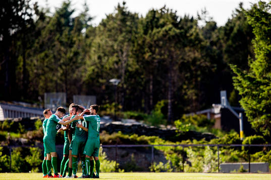 Ståle Steen Sæthre of Nest-Sotra celebrates with teammates after scoring 1-0