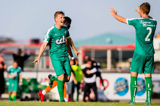 Bjarte Haugsdal and Erlend Hellevik Larsen of Nest-Sotra celebrate