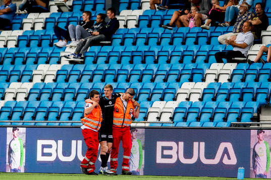 Ari Mohr Jónsson of Sandnes Ulf goes off the pitch with an injury