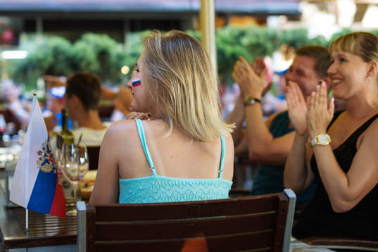 A family celebrates a Russian goal when watching the opening match of the 2018 FIFA World Cup, Russia vs Saudi Arabia, in a restaurant in Gelendzhik of the Krasnodar region in Russia, base camp for the Swedish national football team
