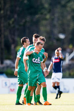Ståle Steen Sæthre of Nest-Sotra celebrates the 4-0 goal with his teammates