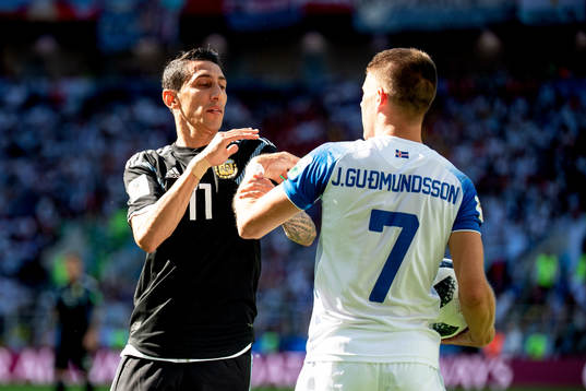 Angel Di Maria of Argentina and Johann Gudmundsson of