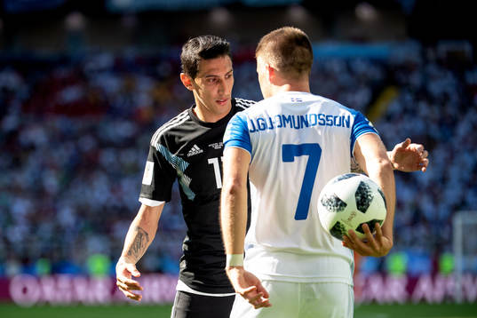 Angel Di Maria of Argentina and Johann Gudmundsson of