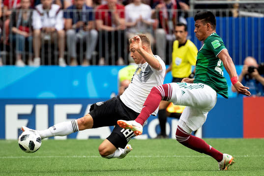 Joshua Kimmich of Germany and Jesus Gallardo of Mexico