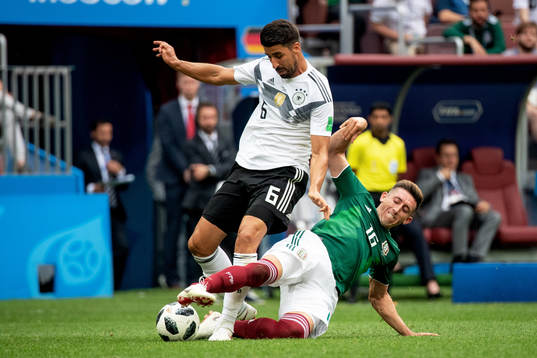 Sami Khedira of Germany and Hector Herrera of Mexico