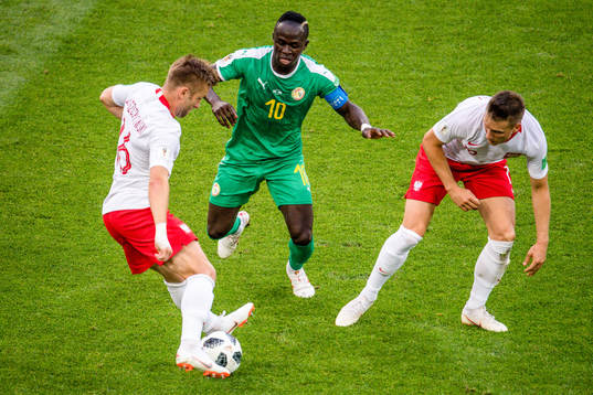 Sadio Mane of Senegal against Jakub Blaszczykowski and