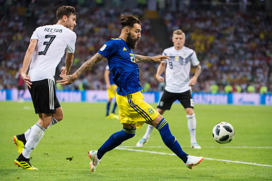 Jonas Hector of Germany and Jimmy Durmaz of Sweden