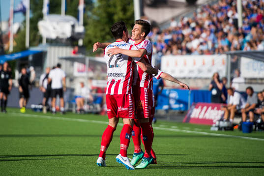 Jostein Gundersen of Tromsø celebrates with his teammate Simen Wangberg of Tromsø after scoring 2-2