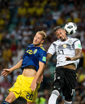 Ola Toivonen of Sweden and Jerome Boateng of Germany