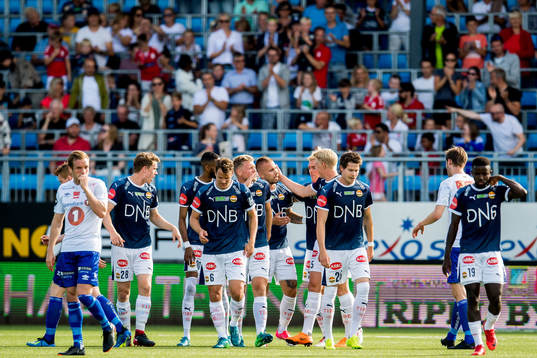 Marcus Pedersen of Strømsgodset celebrates with teammates after scoring 1-0