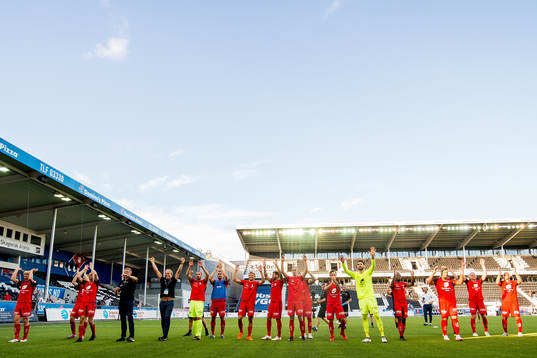 Players and staff of Brann celebrate