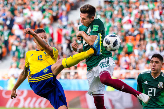 Mikael Lustig of Sweden and Hector Herrera of Mexico