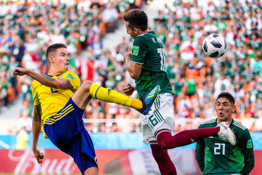 Mikael Lustig of Sweden and Hector Herrera of Mexico