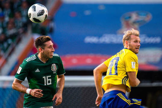 Hector Herrera of Mexico and Ola Toivonen of Sweden