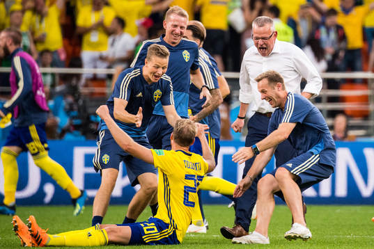 Ola Toivonen, goalkeeper coach Maths Elfvendal, head coach Janne Andersson and performance Manager Paul Balsom of Sweden celebrates