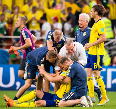Ola Toivonen, goalkeeper coach Maths Elfvendal, head coach Janne Andersson and performance Manager Paul Balsom of Sweden celebrates