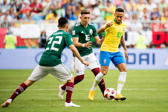 Hector Herrera of Mexico and Neymar of Brazil
