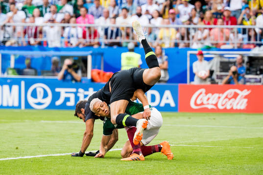 Goalkeeper Alisson of Brazil and Javier Hernandez of Mexico