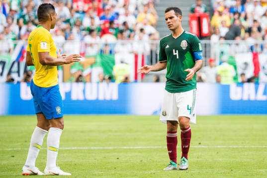 Casemiro of Brazil and Rafael Marquez of Mexico