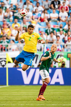 Thiago Silva of Brazil and Javier Hernandez of Mexico