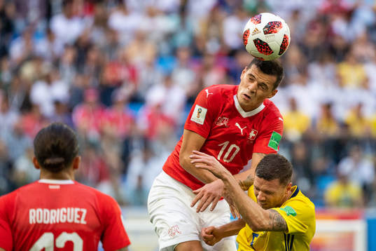 Granit Xhaka of Switzerland and Marcus Berg of Sweden