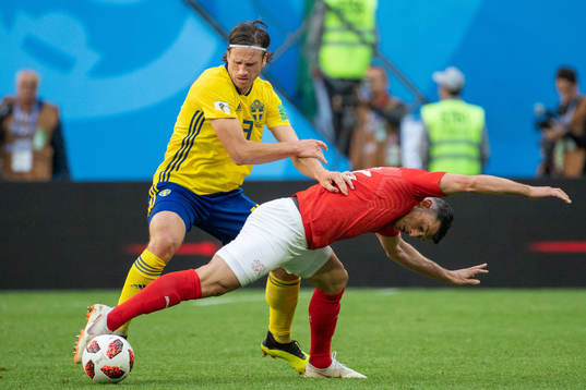 Gustav Svensson of Sweden and Manuel Akanji of Switzerland