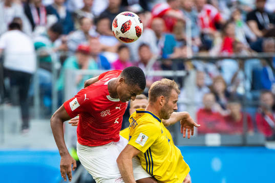 Manuel Akanji of Switzerland and Ola Toivonen of Sweden
