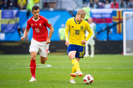 Granit Xhaka of Switzerland and Emil Forsberg of Sweden