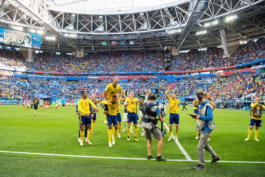 Ola Toivonen jumps up onto the back of Isaac Kiese Thelin