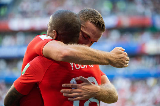 Jordan Henderson hugs Ashley Young