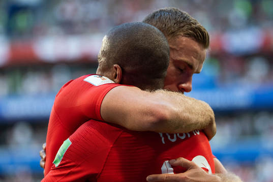  Ashley Young and Jordan Henderson of England  hugs when celebrating 1-0