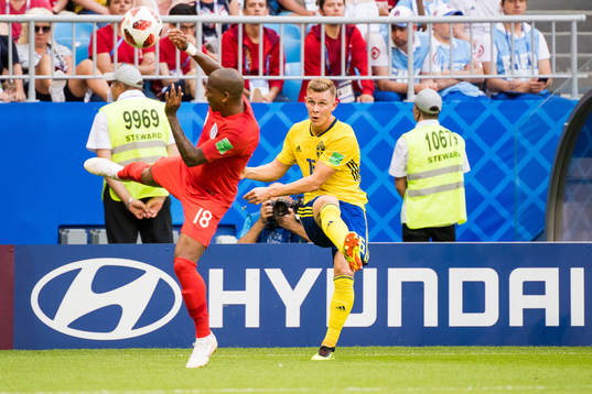 Ashley Young of England and Emil Krafth of Sweden