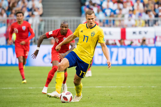 Ashley Young of England and Viktor Claesson of Sweden