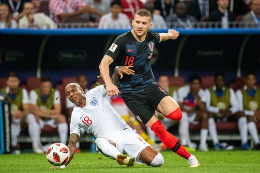 Ashley Young of England and Ante Rebic of Croatia competes