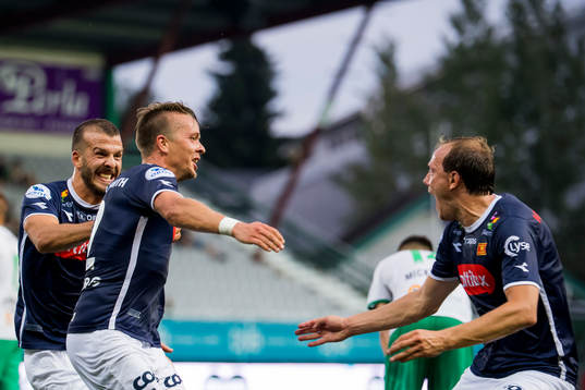 Claes Kronberg of Viking celebrates with his teammates Zlatko Tripic and Rolf Daniel Vikstøl of Viking after scoring 2-3