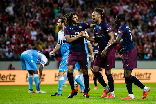 Pierre-Emerick Aubameyang of Arsenal celebrates with teammates Mohamed Elneny och Ainsley Maitland-Niles after 2-0