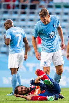 Markus Rosenberg of Malmö FF reacts against Boban Nikolov of Vidi