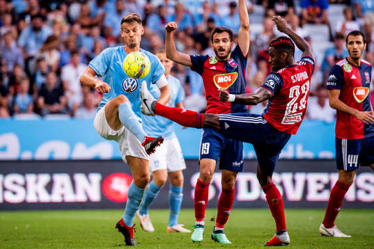 Markus Rosenberg of Malmö FF and Boban Nikolov and Stopira of Vidiv