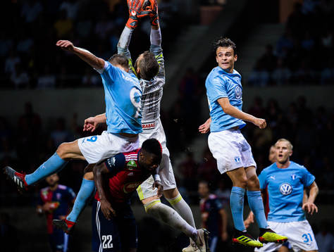 goalkeeper Stefan Scepovic of Vidi with a save infront of Markus Rosenberg and Andreas Vindheim of Malmö FF