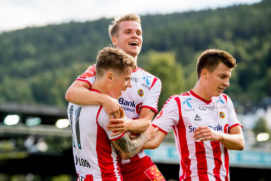Robert Taylor of Tromsø celebrates with teammates Mikael Nord Ingebrigtsen and Jostein Gundersen after scoring 1-1