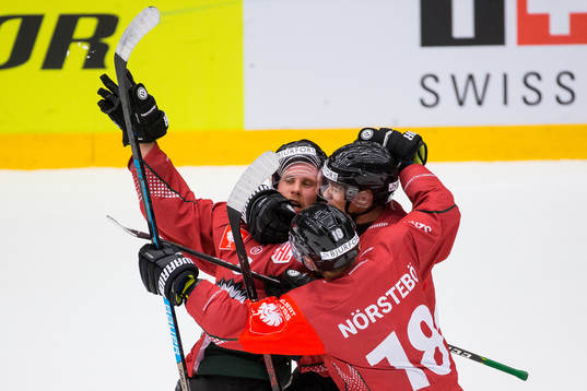 Viktor Ekbom celebrates with Joel Mustonen and Mattias
