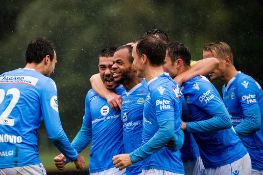 Erixon Danso of Sandnes Ulf celebrates with teammates after the 1-3 goal