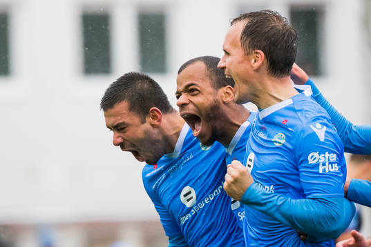 Erixon Danso of Sandnes Ulf celebrates with his teammates after scoring 1-3
