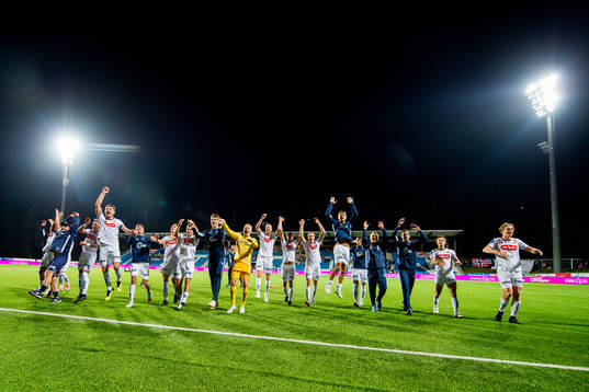 Axel Andresson, goalkeeper Amund Wichne and the players of Viking celebrate